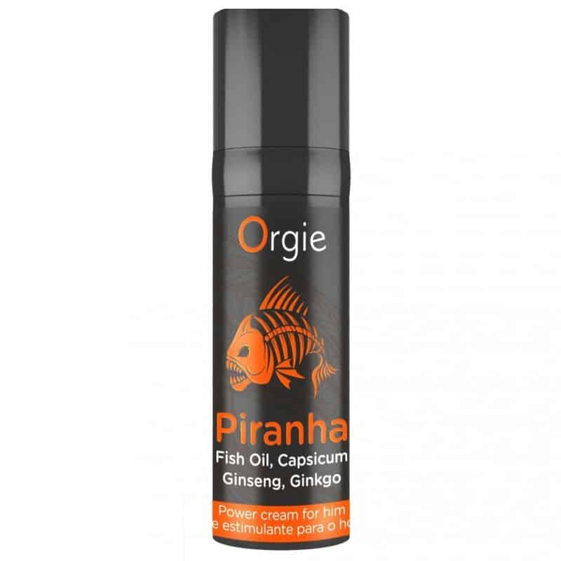 Envase negro de crema potenciadora Piranha de Orgie, con ilustración naranja de un pez