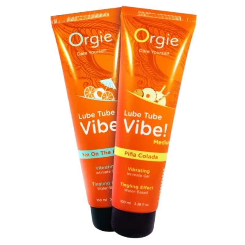 Dos tubos naranjas Orgie Lube Tube Vibe!, uno con la franja Piña Colada y otro con Sex On The Beach